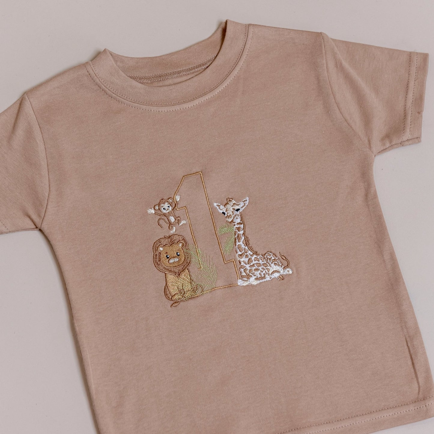 Personalised safari animal t-shirts for kids, available in beige/tan or white