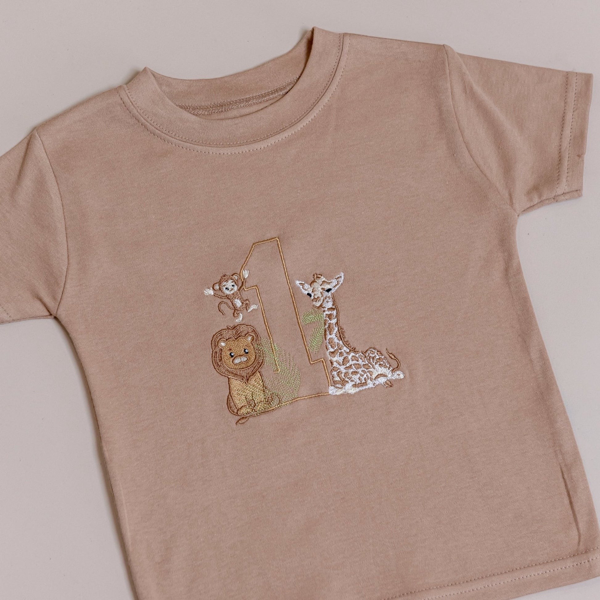 Personalised safari animal t-shirts for kids, available in beige/tan or white
