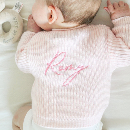baby pink knit cardigan with hot pink embroidered name 