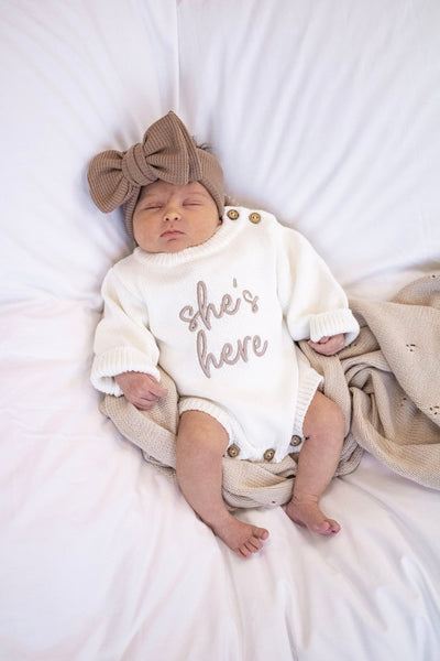 'She's / He's Here' Baby Romper | White