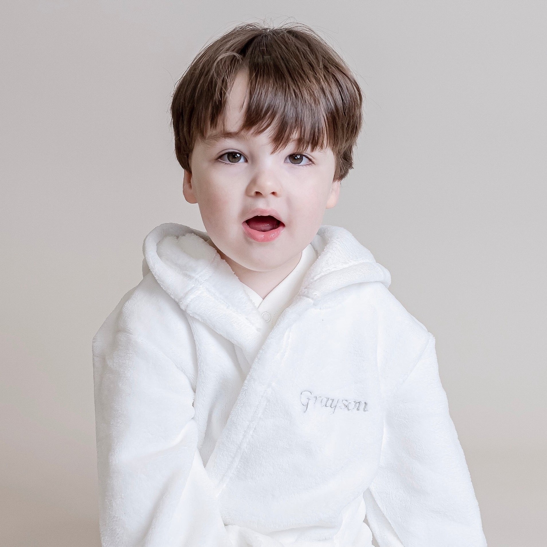 White personalised baby bath robe with elegant embroidery