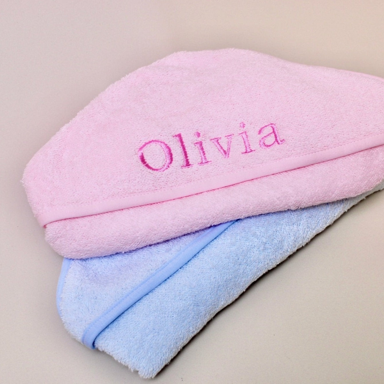 pink and blue baby hooded towels with embroidered name 