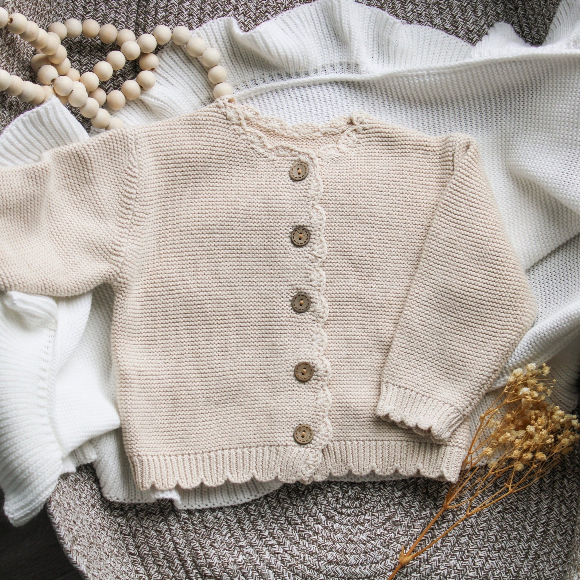 Soft Beige Knit Baby Cardigan with Scalloped Edges