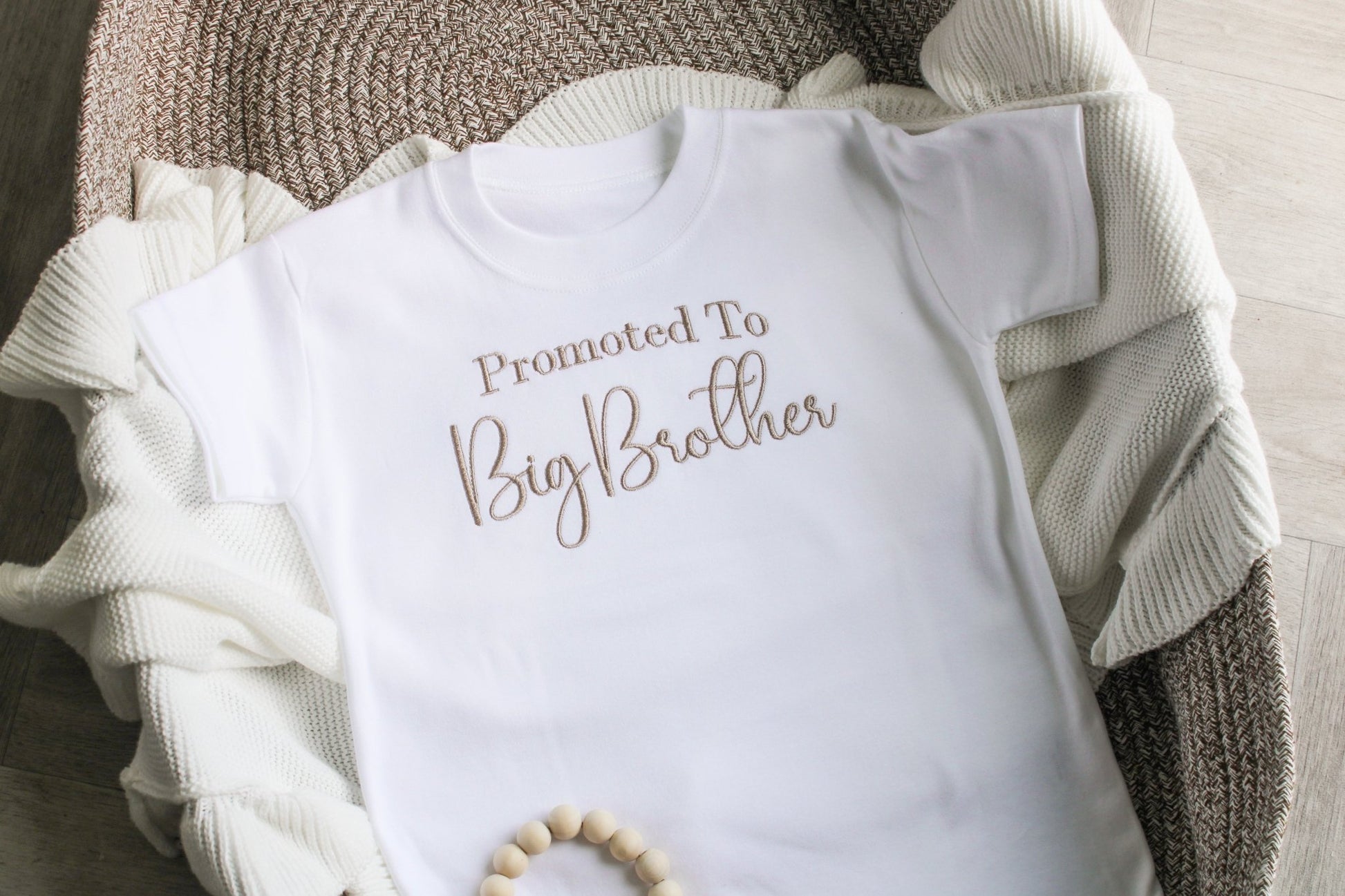 Children's t-shirt displaying 'promoted to big brother' across the chest 